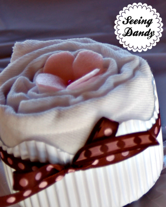 DIY burp cloth cupcake, pink felt flower, decorative sewing pin, decorative ribbon