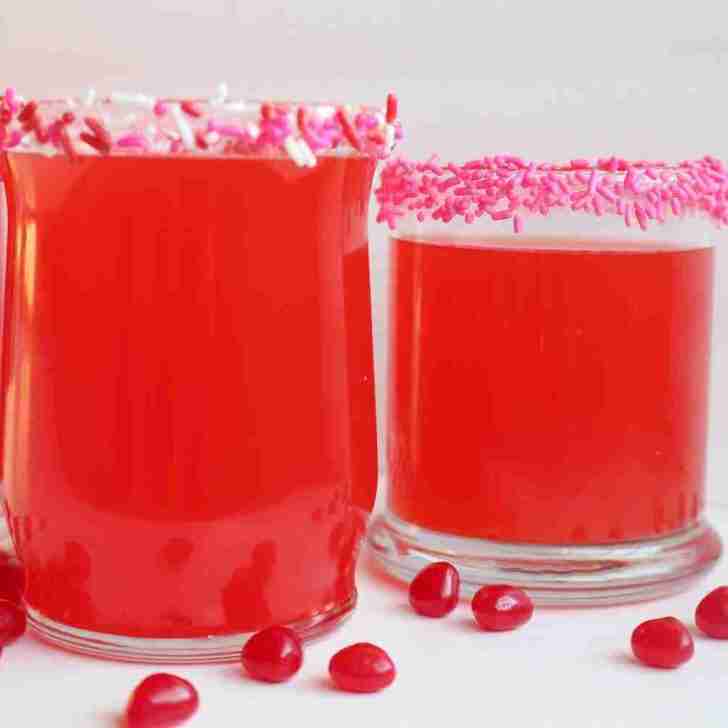 Red Hots Valentines Day punch glasses with decorative sprinkles.