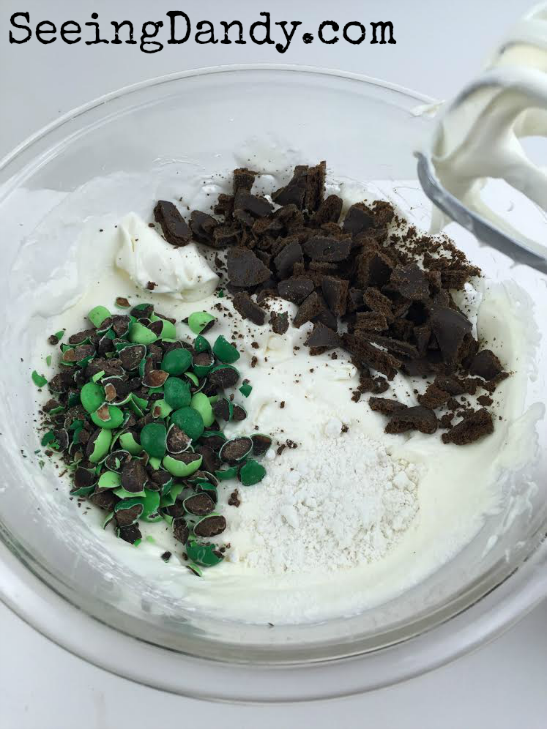 Mixing mint candies and crushed Girl Scout Cookies