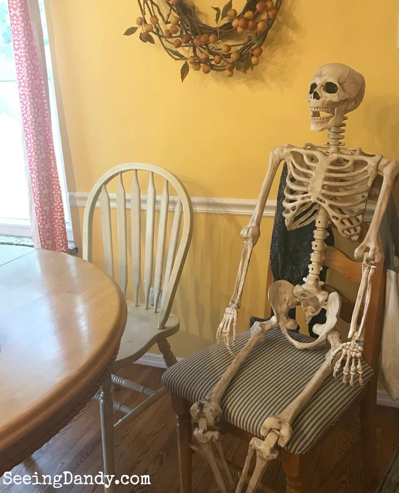 Skeleton at the kitchen table to decorate like the Haunted Mansion.