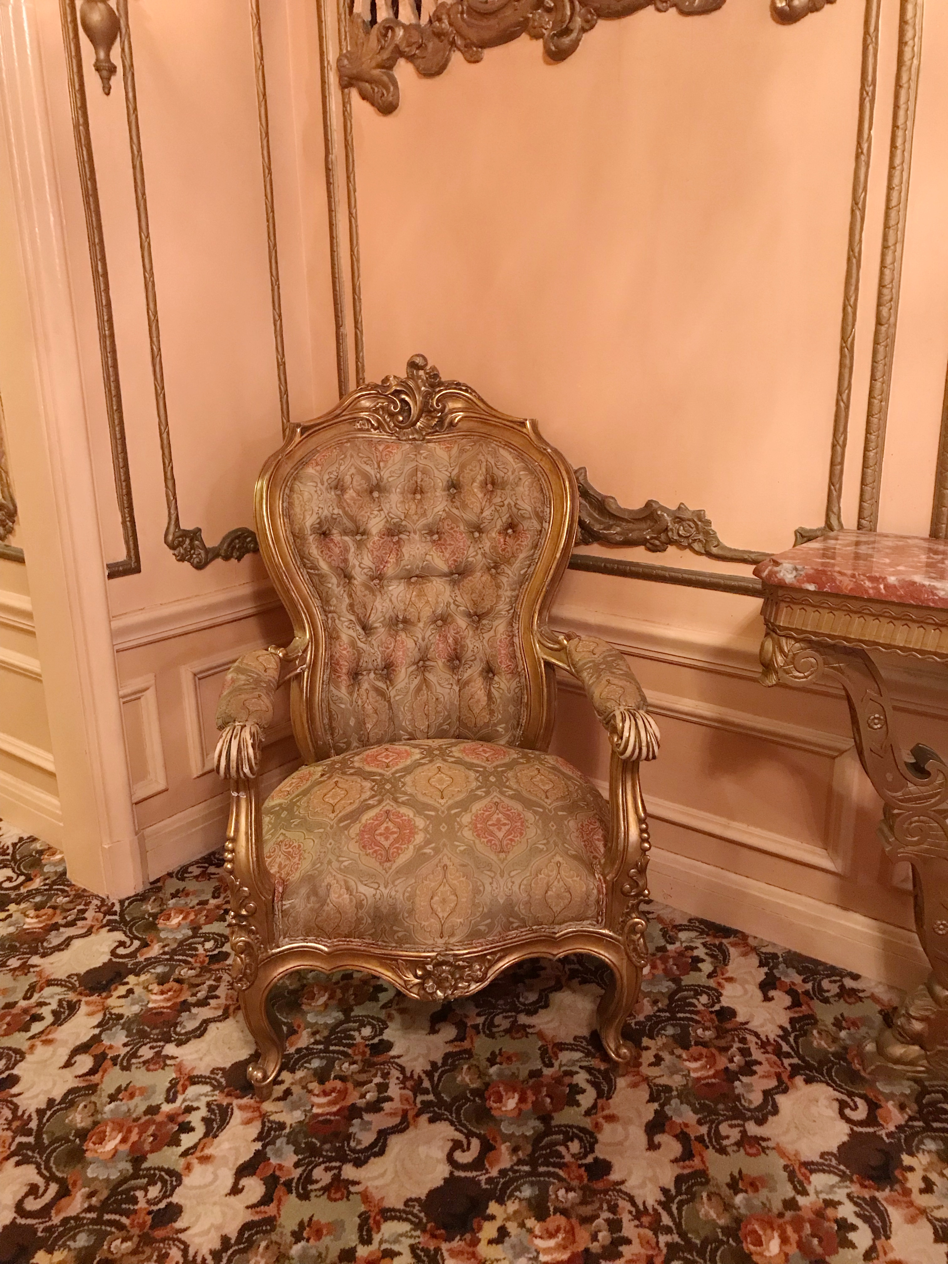 Vintage chair and floral carpet at the St. Louis Fox Theatre.