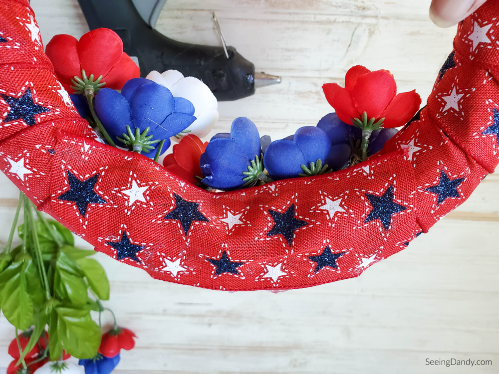 attaching ribbon to cover poppy flowers, holiday decor