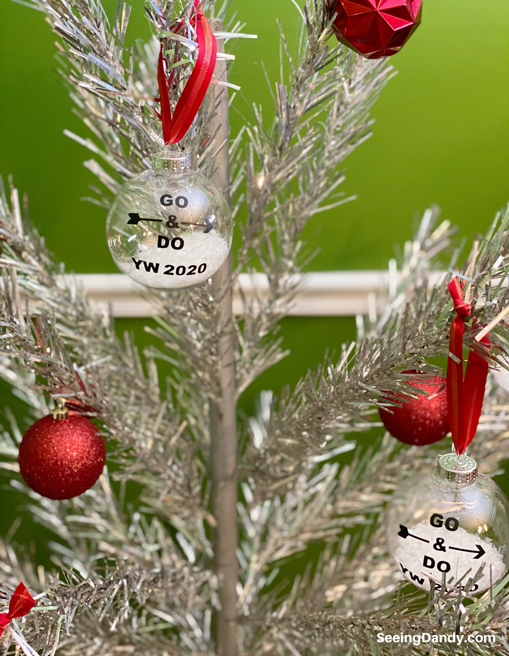 aluminum christmas tree, lds christmas ornaments, craft ornaments, DIY YW Christmas ornament, 2020 youth theme, go and do, the church of jesus christ of latter day saints, easy to make christmas ornaments, free svg file, red ribbon, clear ball ornaments, plastic ornaments, vintage christmas tree, red retro ornaments, silver tree