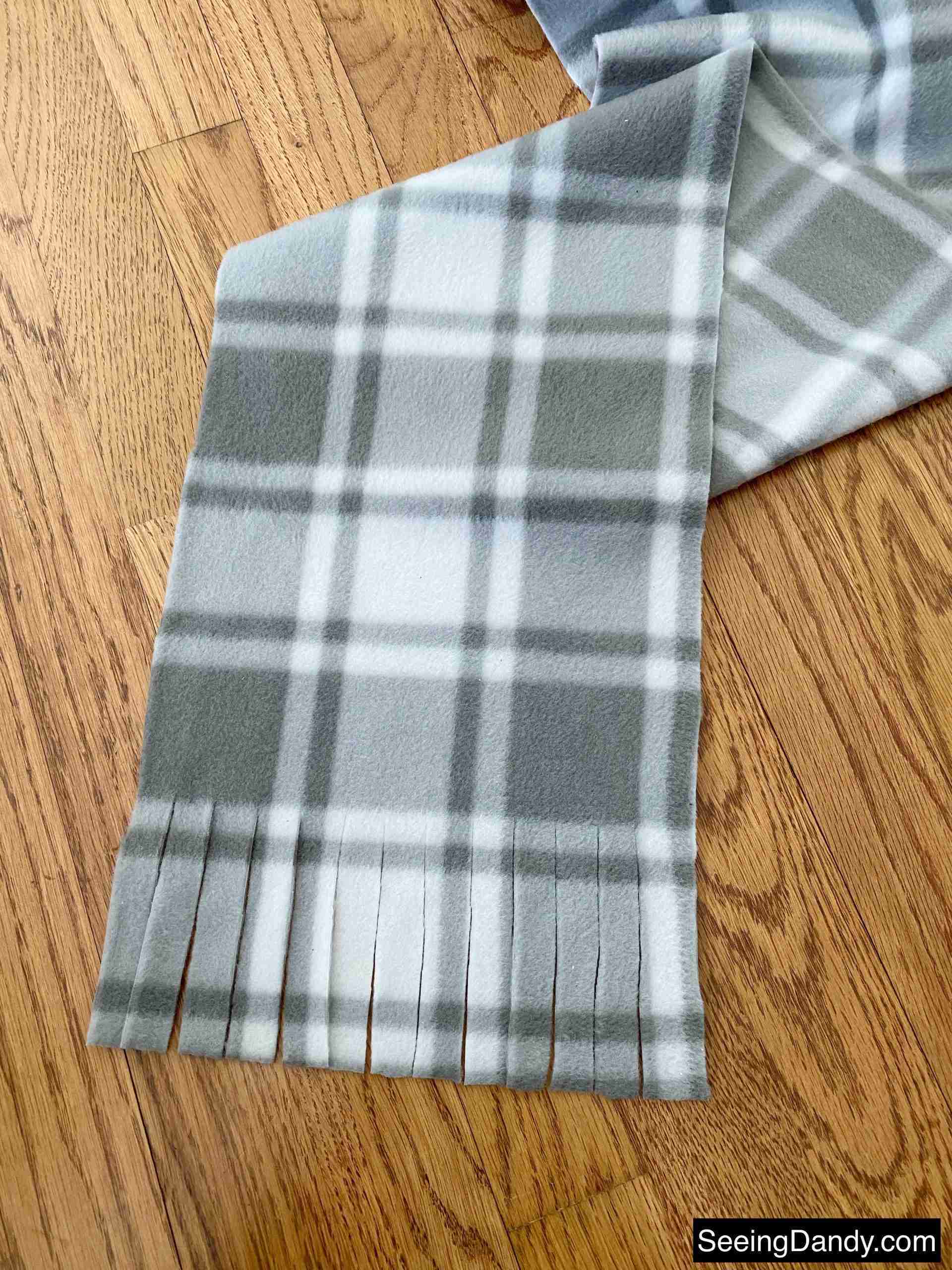 fleece scarf fringe, gray plaid fleece scarf, honey oak hardwood floor