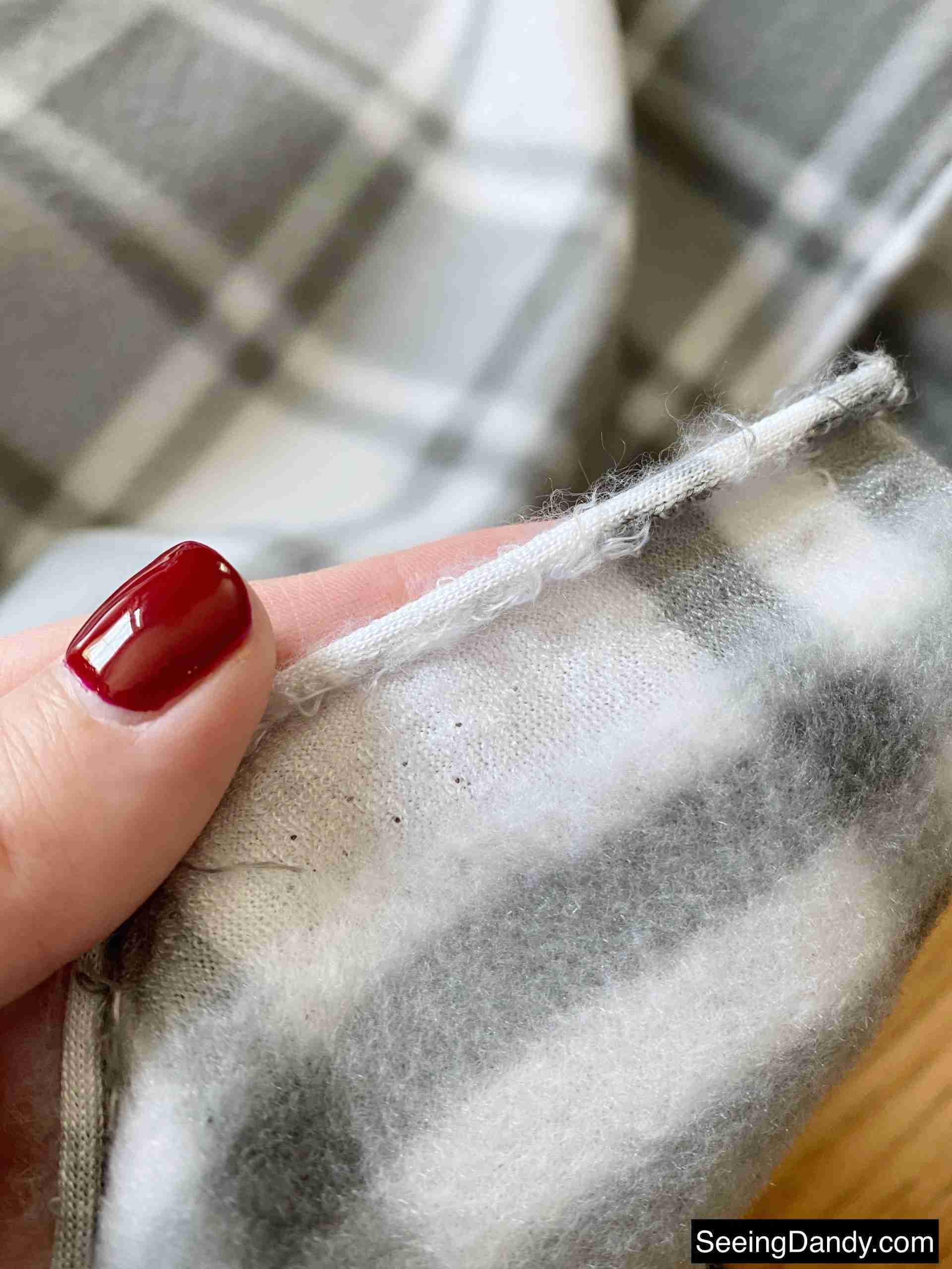 fleece fabric selvage edge, gray plaid fleece, red gel nail polish