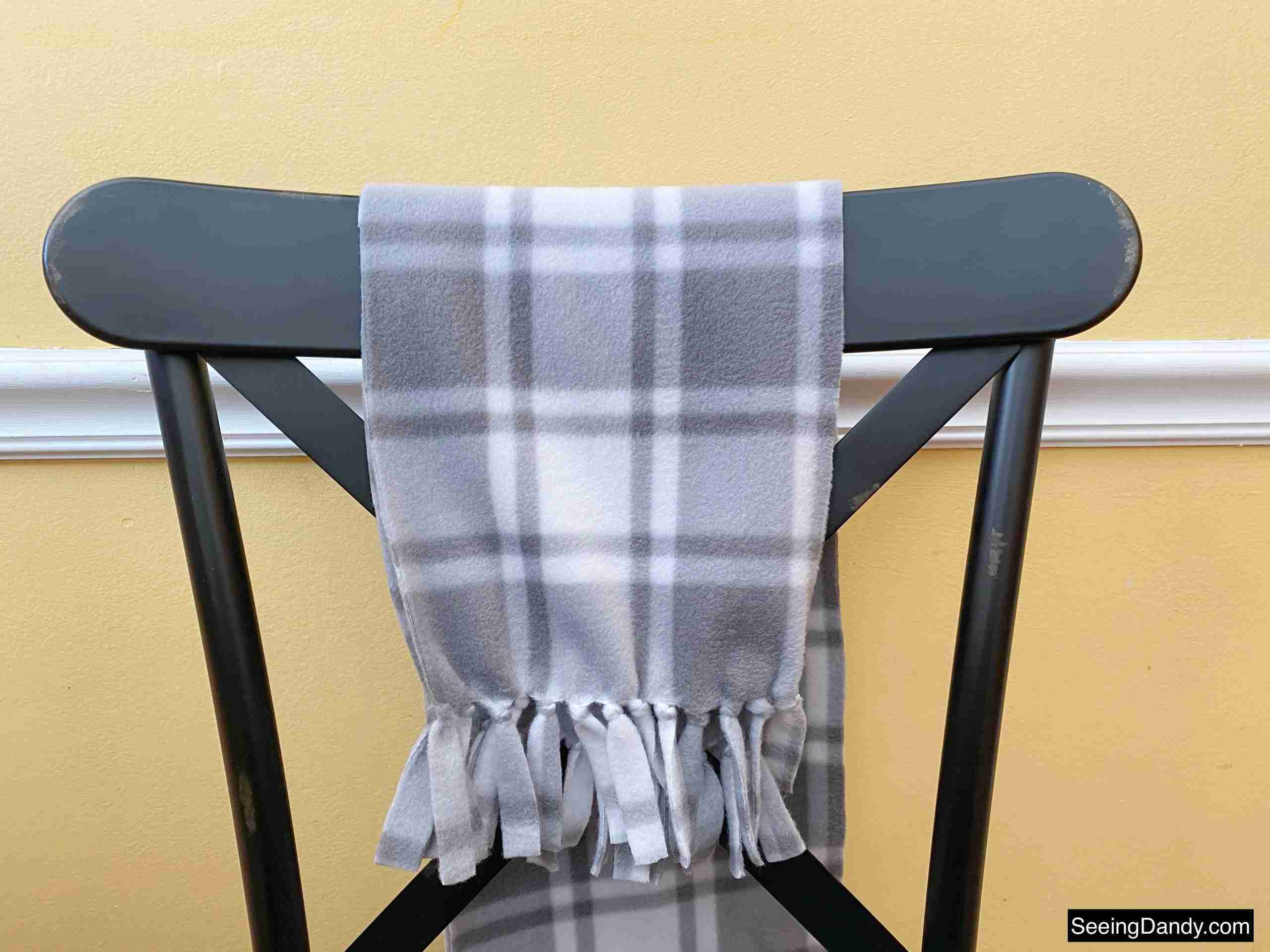 tied fleece scarf, gray plaid fleece scarf, black farmhouse style kitchen chair, metal dining chair, yellow kitchen wall, white kitchen chair rail, diy no sew fleece scarf