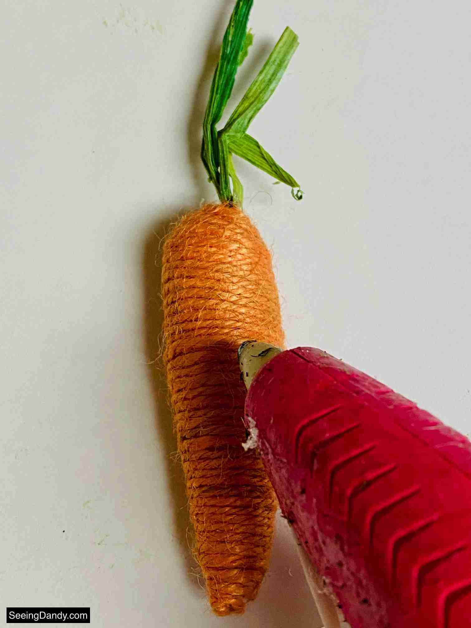 Dollar Tree twine carrot, pink hot glue gun