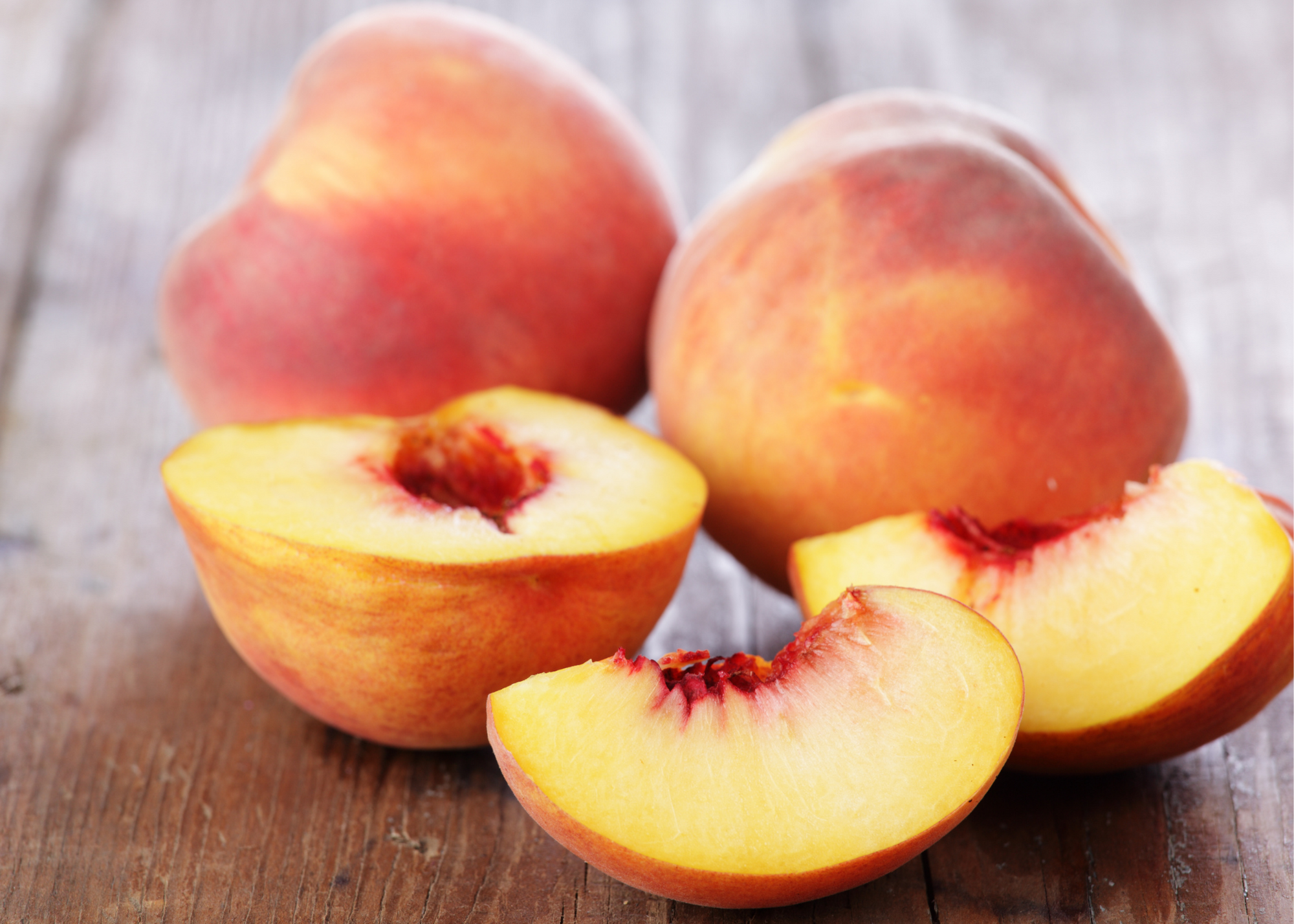 wood farmhouse table, peaches, peach slice, peach halves fresh fruit peaches