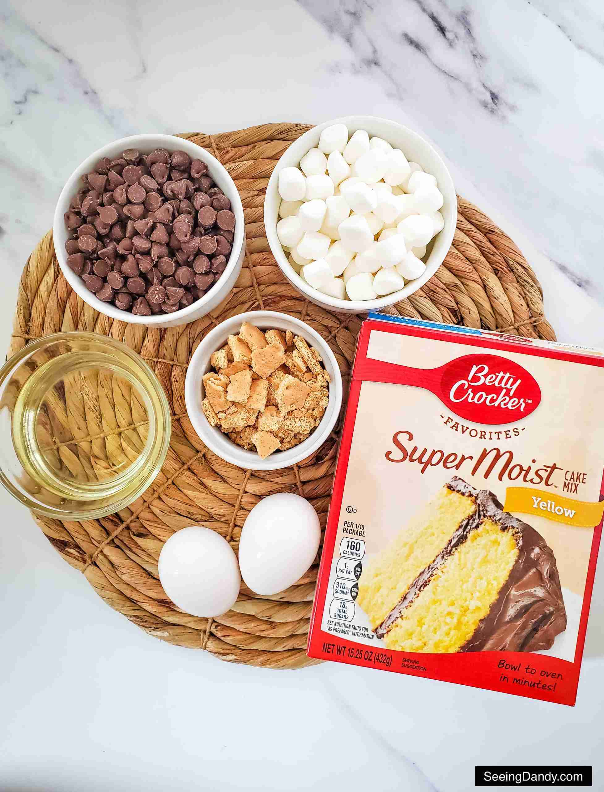 cake mix cookies, s'more ingredients, s'more recipes, betty crocker favorites super moist yellow cake mix, mini marshmallows, chocolate chips, small graham crackers, fresh eggs, cooking oil, marble countertop 