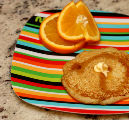 Cream of Wheat pancake on a strip breakfast plate.