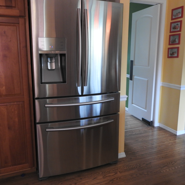 Cleaning stainless steel refrigerators in the kitchen.