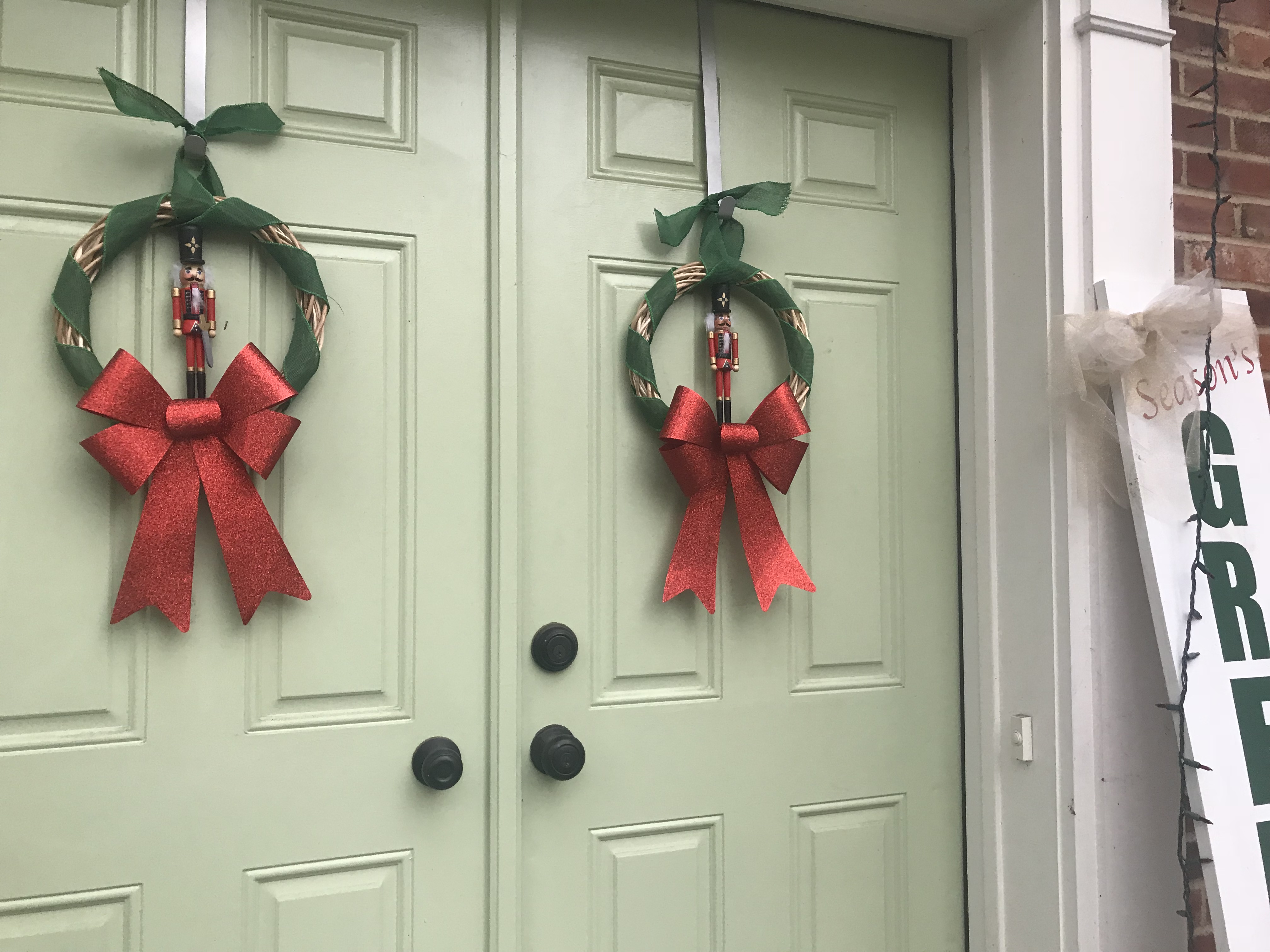 DIY Nutcracker Christmas wreath on front doors.