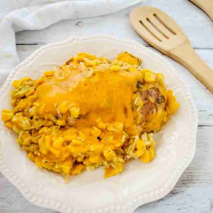 crockpot cheesy chicken, delicious recipes, easy meals, dinner recipe, chicken dinner, white country dinnerware, wooden spoon, farmhouse table