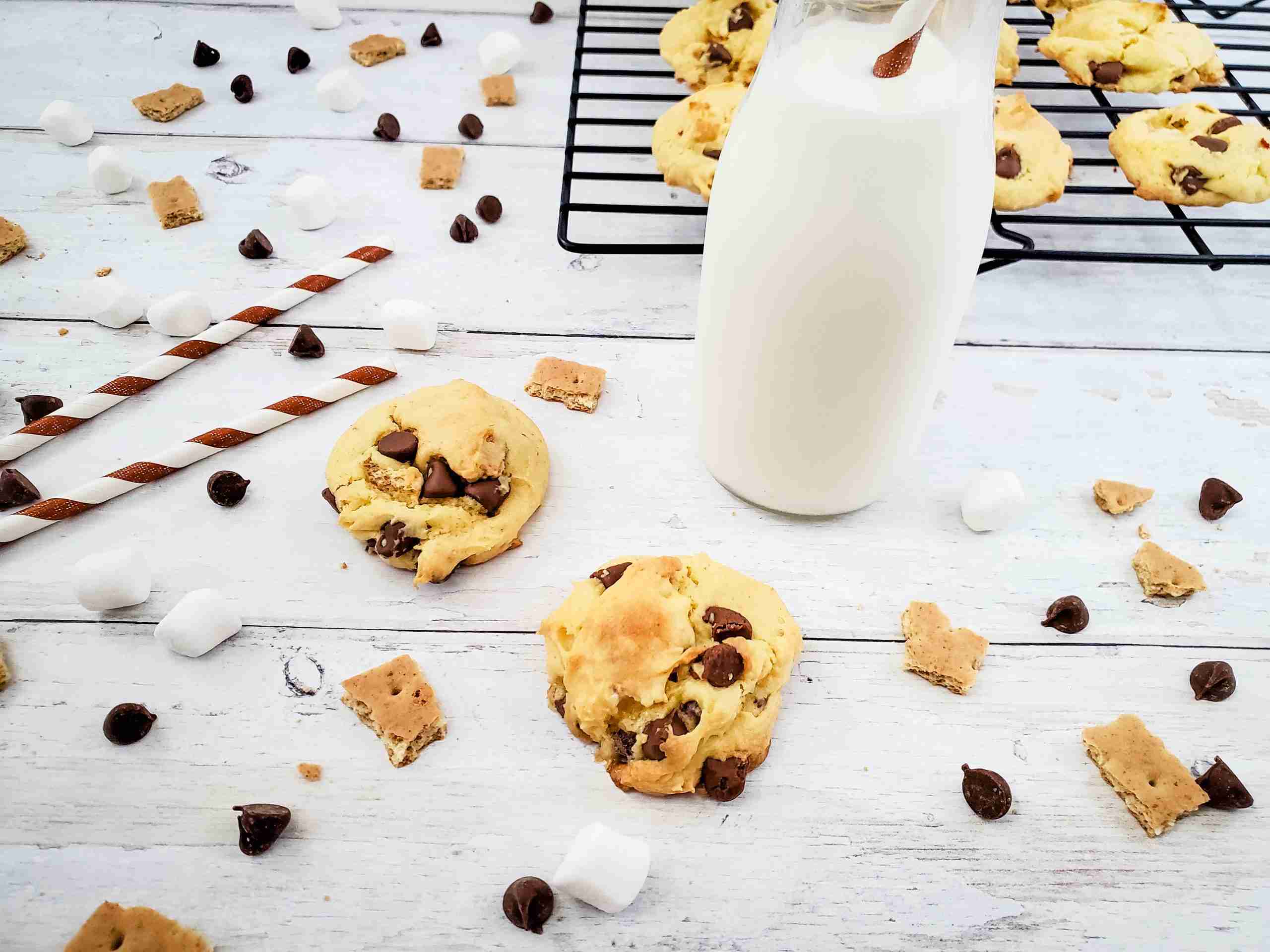 s'mores cookies, mini marshmallows, chocolate chips, small graham crackers, fall recipes, cookie recipes, s'more recipes, farmhouse table, cookie cooling rack, glass milk bottle, brown white stripe paper straws